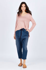 Model Georgia wearing size 10 of the Just Chillin Stretch Dropped Crotch Jeans in colour Denim (Blue), from the front, showing the whole outfit