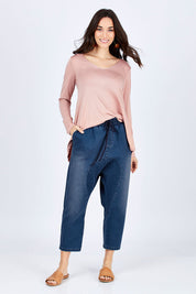Model Georgia wearing size 10 of the Just Chillin Stretch Dropped Crotch Jeans in colour Denim (Blue), from the front, showing the whole outfit