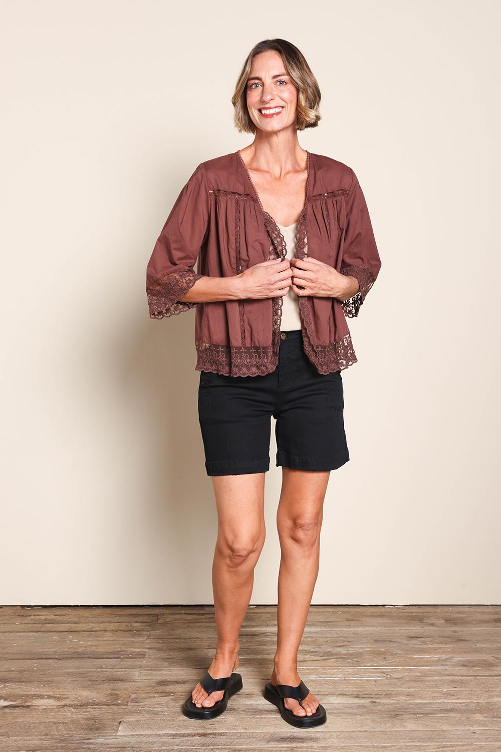 Model Riinar wearing size 10 of the Spring Day Throw – Chocolate in colour Chocolate, from the front