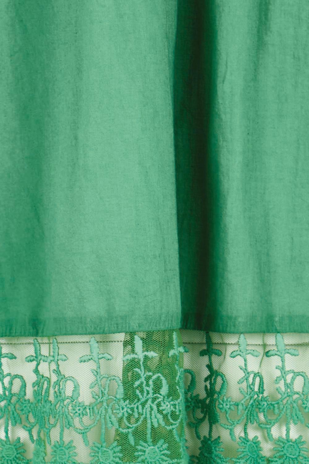 Product shot of the Spring Day Cotton Throw – Green in colour Green, showing detail