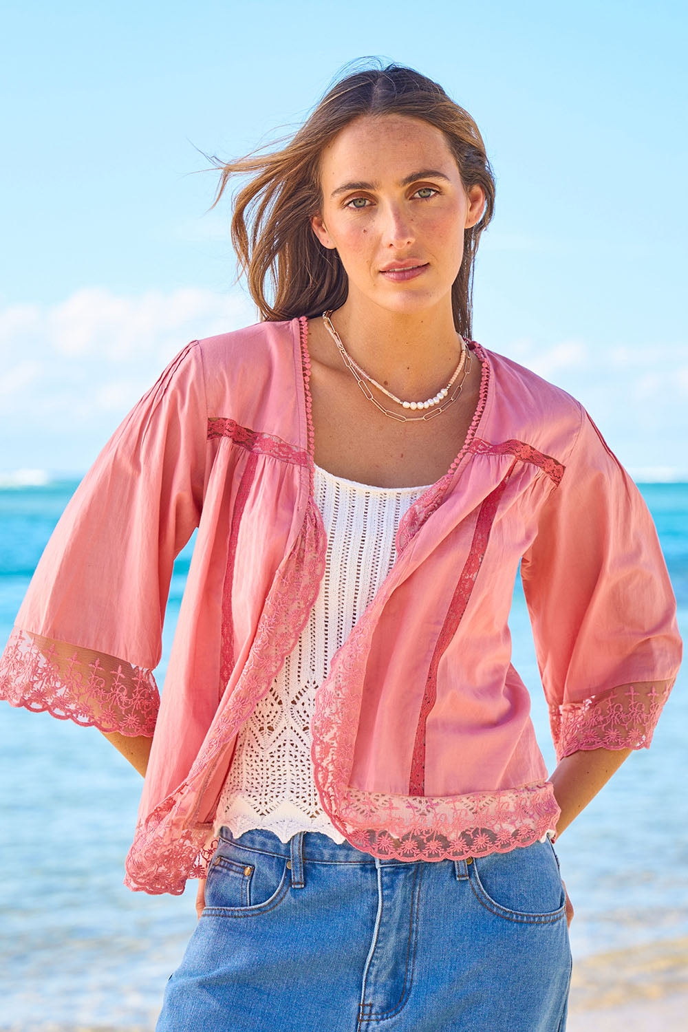 Model Tegan wearing size 10 of the Spring Day Cotton Throw in colour Rose (Pink), from the front, showing the whole outfit