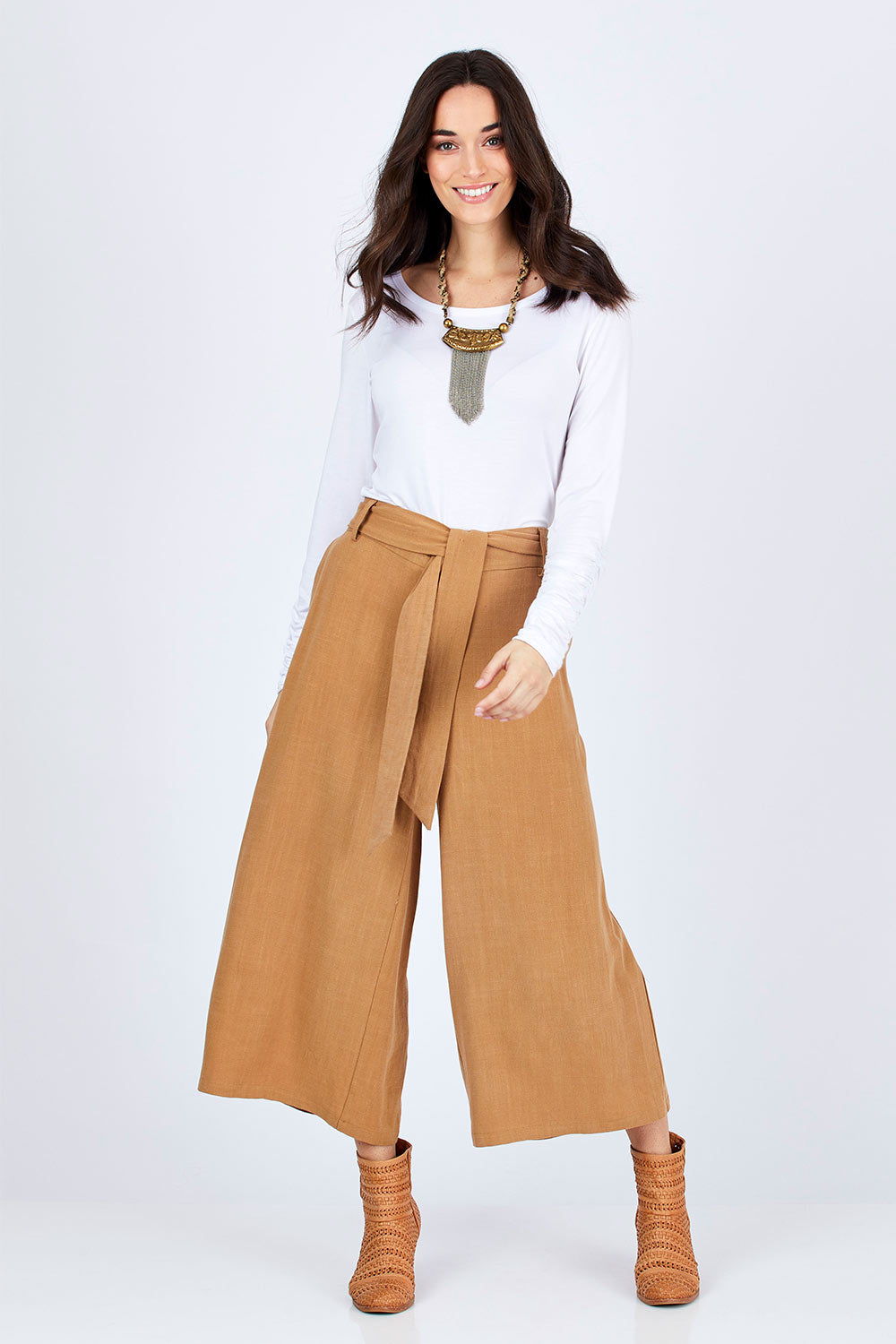 Model Georgia wearing size 10 of the Coyote Wide Leg Linen Blend Pant in colour Camel, from the front, showing the whole outfit