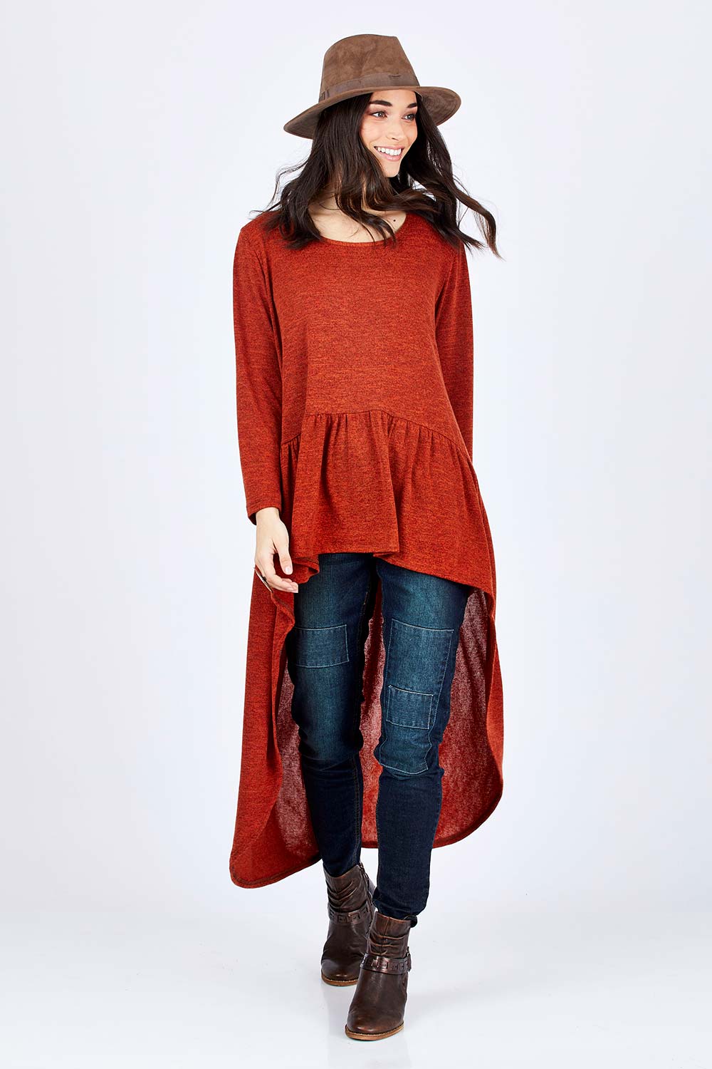 Model Georgia wearing size 10 of the Falling For You Tunic in colour Rust, from the front, showing the whole outfit