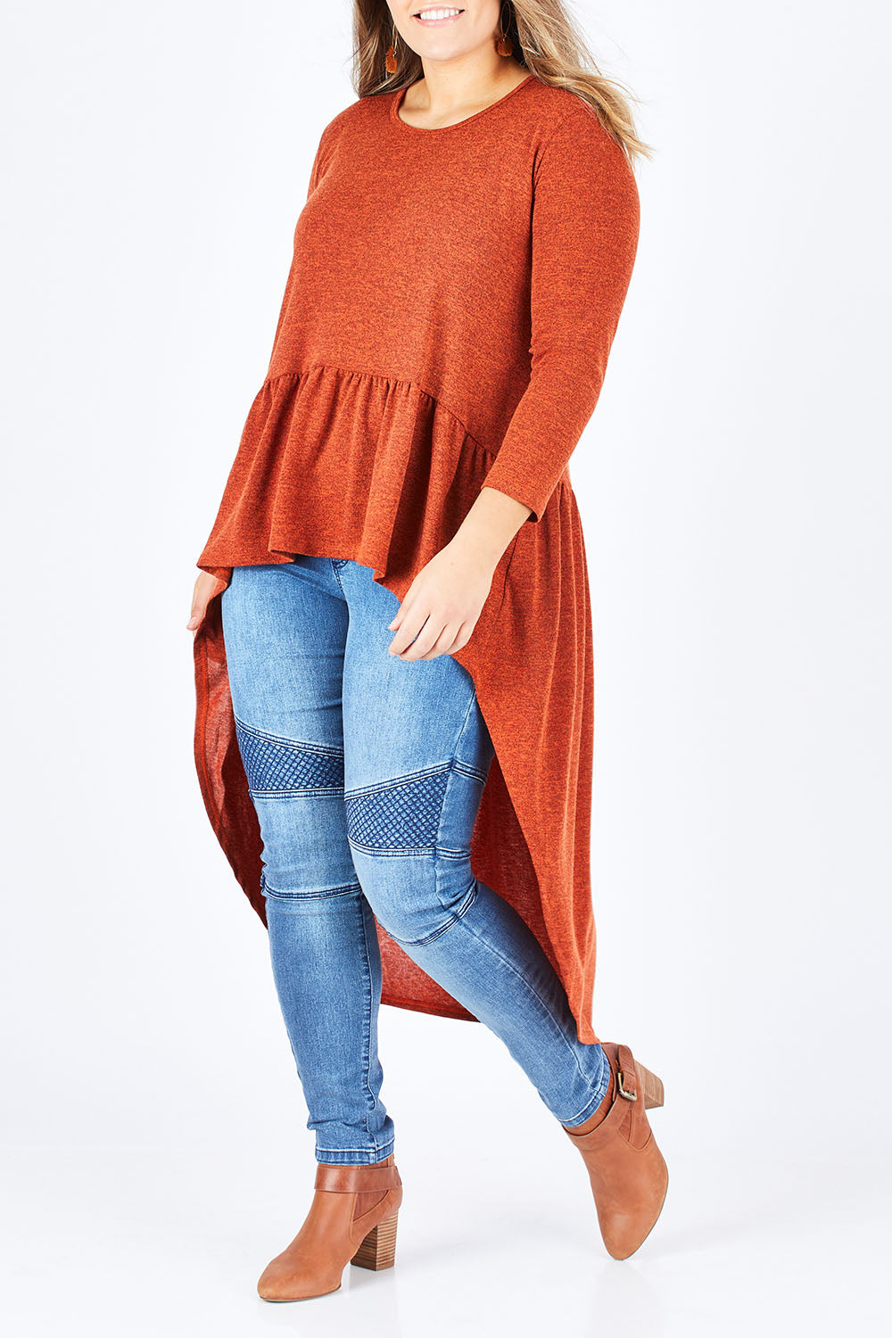 Model Natalia wearing size 14 of the Falling For You Tunic in colour Rust, from the front, cropped image