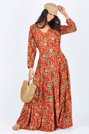 Model Gemma wearing size 10 of the Meet Under The Palm Tree Maxi in colour Earth, from the front, showing the whole outfit