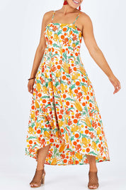 Model Palatina wearing size 14 of the Dancing By Sunset Dress in colour Floralspot, from the front, cropped image