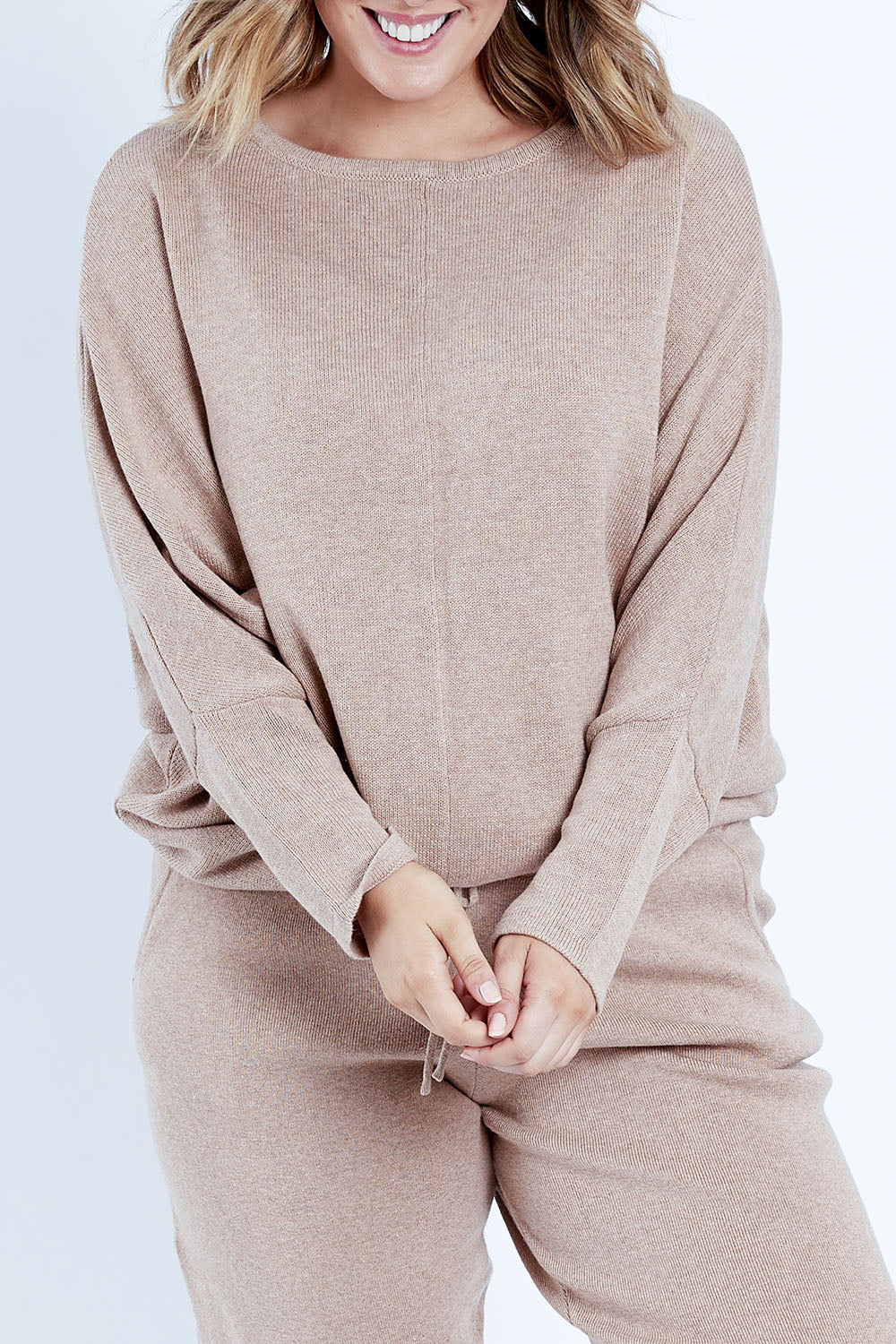 Model Jess wearing size L of the Snuggle Up Cotton Cashmere Jumper in colour Latte, from the front, cropped image