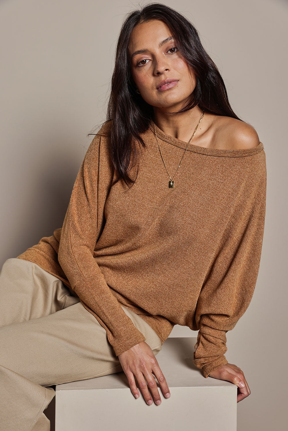 Model Tahnee wearing size 10 of the Snuggle Up Jumper in colour Coffee, from the front, cropped image