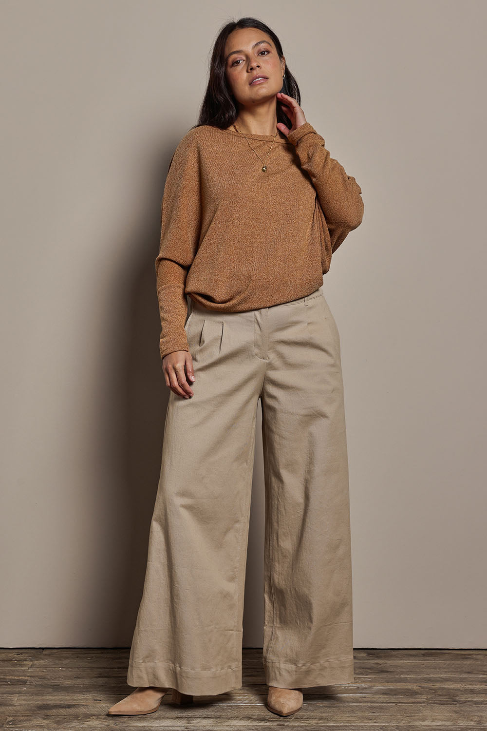 Model Tahnee wearing size 10 of the Snuggle Up Jumper in colour Coffee, from the front, showing the whole outfit