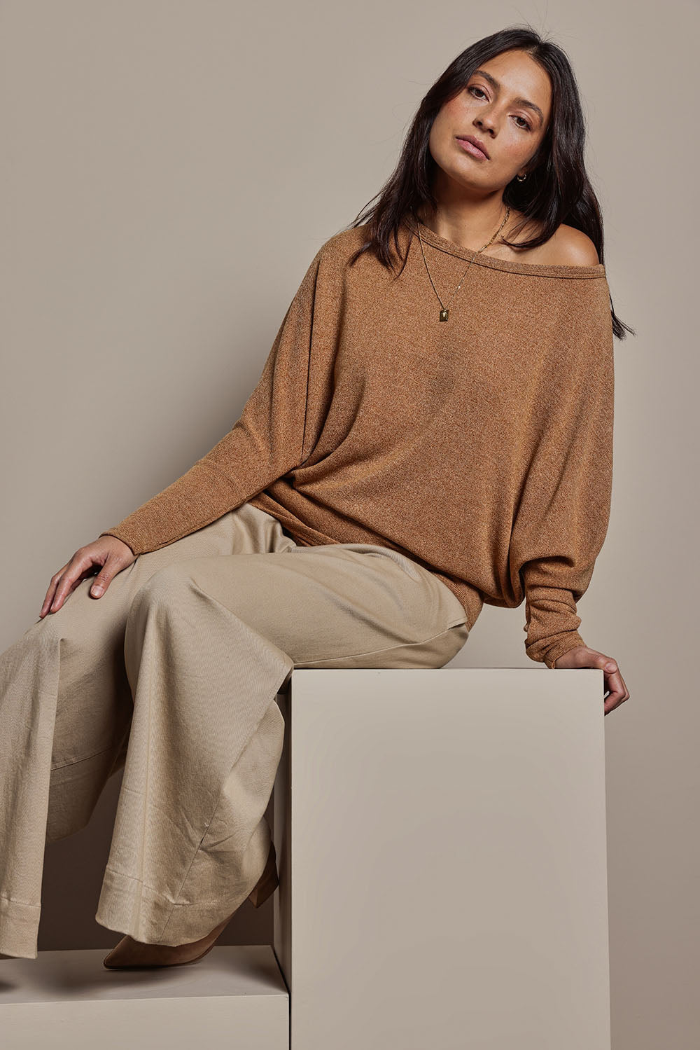 Model Tahnee wearing size 10 of the Snuggle Up Jumper in colour Coffee, from the front, showing the whole outfit