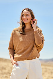 Model Tegan wearing size 10 of the Snuggle Up Jumper in colour Coffee, from the front, showing the whole outfit
