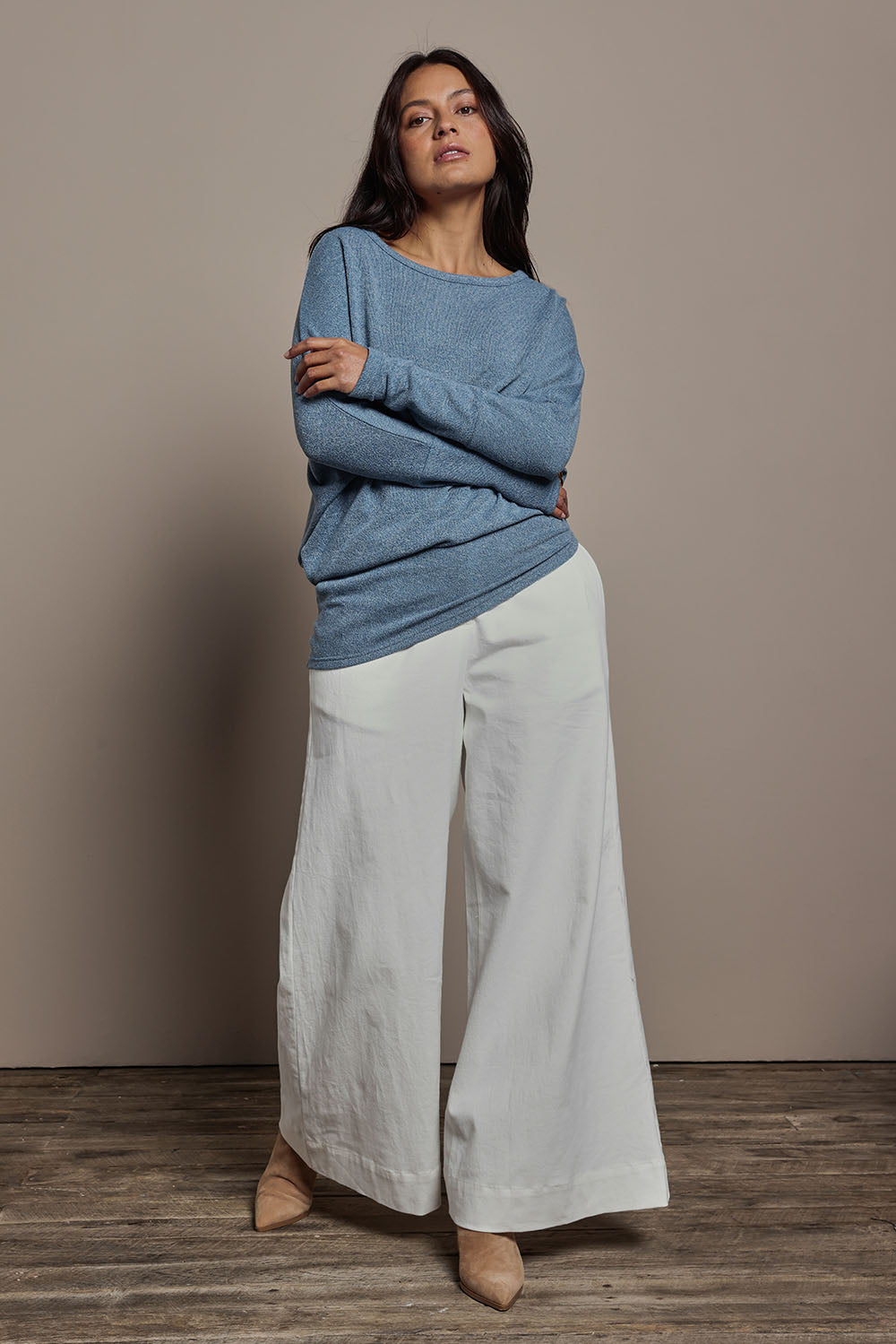 Model Tahnee wearing size 10 of the Snuggle Up Jumper in colour Denim (Blue), from the front, showing the whole outfit