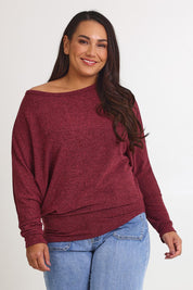 Model Ashleigh wearing size 16 of the Snuggle Up Jumper in colour Grape (Purple), from the front, cropped image