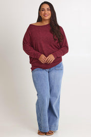 Model Ashleigh wearing size 16 of the Snuggle Up Jumper in colour Grape (Purple), from the front, showing the whole outfit