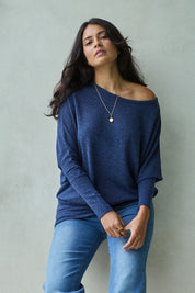 Model Tahnee wearing size 10 of the Snuggle Up Jumper in colour Indigo (Blue), from the front, showing the whole outfit