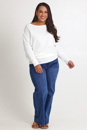 Model Ashleigh wearing size 16 of the Snuggle Up Jumper in colour Ivory (White), from the front, showing the whole outfit