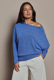 Model Tahnee wearing size 10 of the Snuggle Up Jumper in colour Lapis (Blue), from the front, cropped image