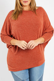 Model Fiona wearing size 16 of the Snuggle Up Jumper in colour Rust, from the front, cropped image