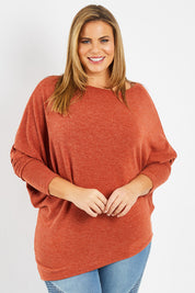 Model Fiona wearing size 16 of the Snuggle Up Jumper in colour Rust, from the front, cropped image