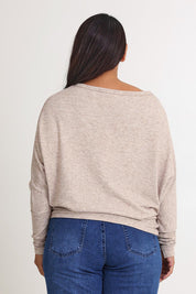 Model Ashleigh wearing size 16 of the Snuggle Up Jumper in colour Sandmarl, from the back