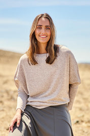 Model Tegan wearing size 10 of the Snuggle Up Jumper in colour Sandmarl, from the front, showing the whole outfit