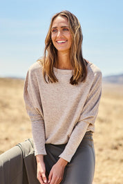 Model Tegan wearing size 10 of the Snuggle Up Jumper in colour Sandmarl, from the front, showing the whole outfit