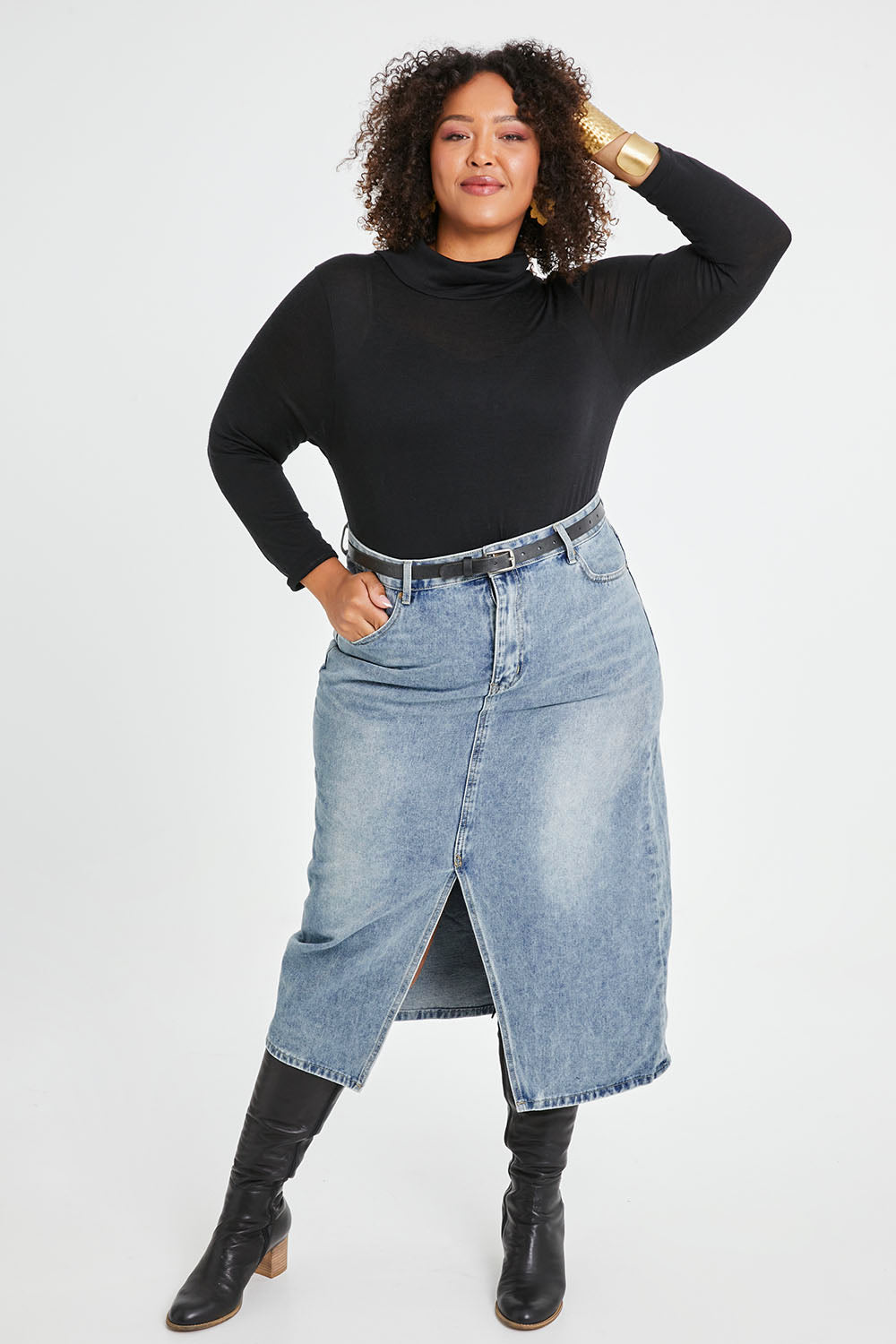 Model Alexis wearing size 16 of the Happy Me Denim Skirt in colour Denim (Blue), from the front, showing the whole outfit