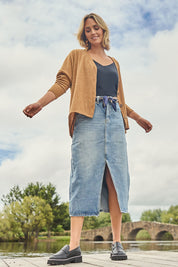 Model Tegan wearing size 10 of the Happy Me Denim Skirt in colour Denim (Blue), from the front, showing the whole outfit