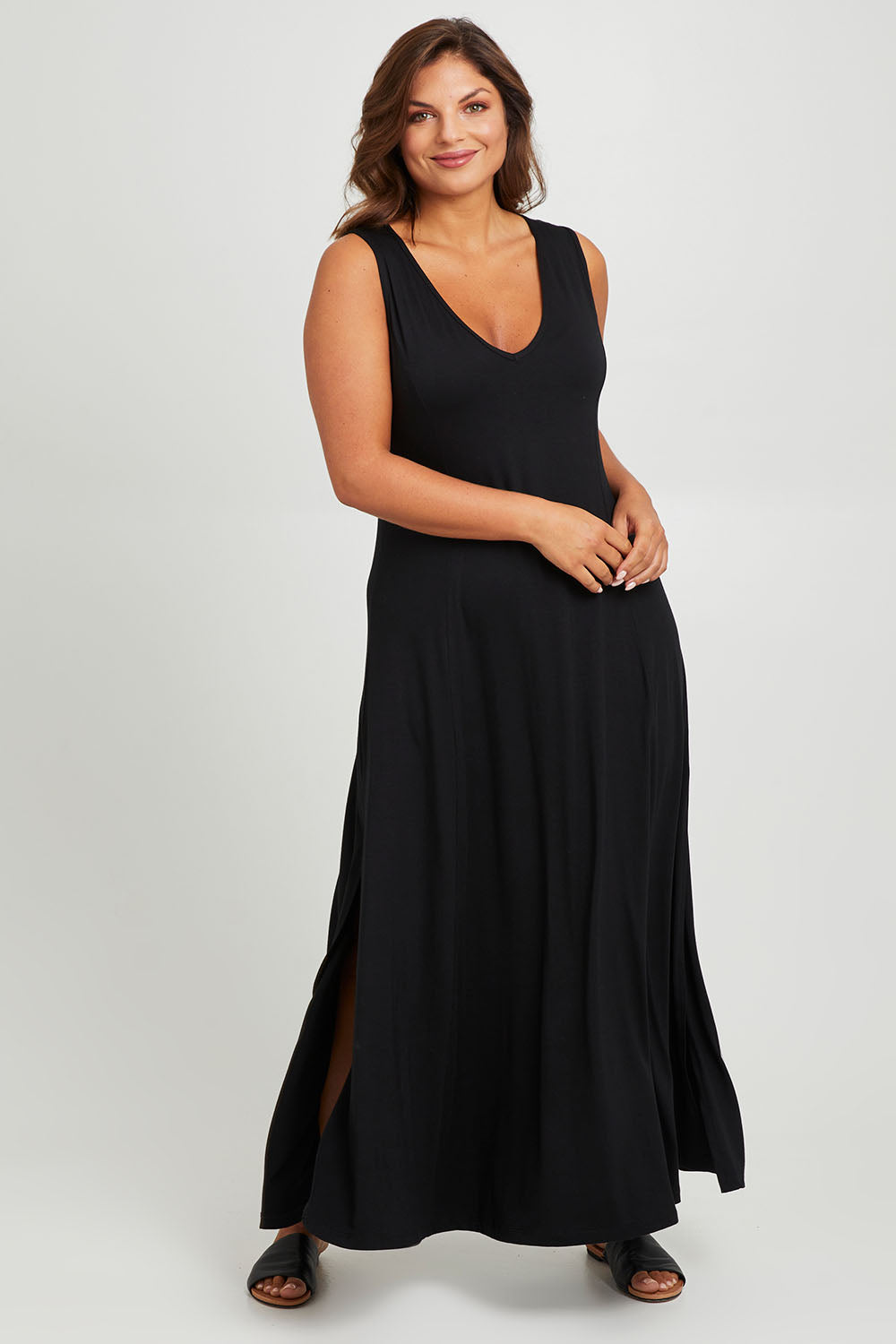 Model Monique wearing size 14 of the My Faithful Maxi Singlet Dress in colour Black (Black), from the front, showing the whole outfit