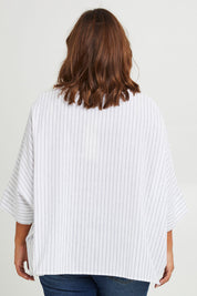 Model Monique wearing size 14 of the Joy And Laughter Slouch Top in colour Whitestrip (White), from the back