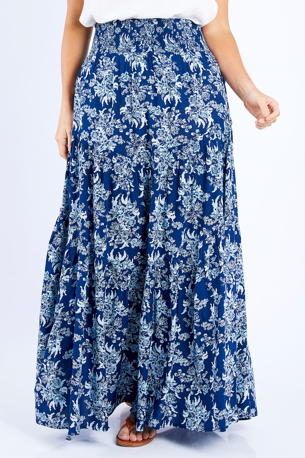Model Laura wearing size 14 of the Skirting Around The Garden Skirt in colour Bluefleur (Blue), from the front, cropped image