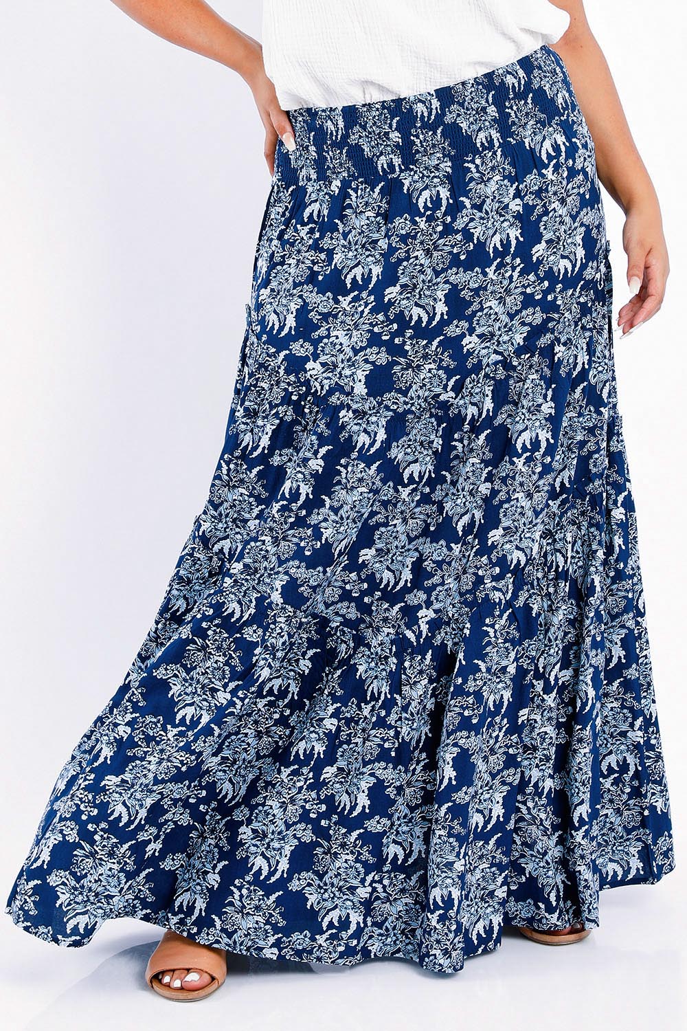 Model Sasha-Lee wearing size 16 of the Skirting Around The Garden Skirt in colour Bluefleur (Blue), from the front, cropped image