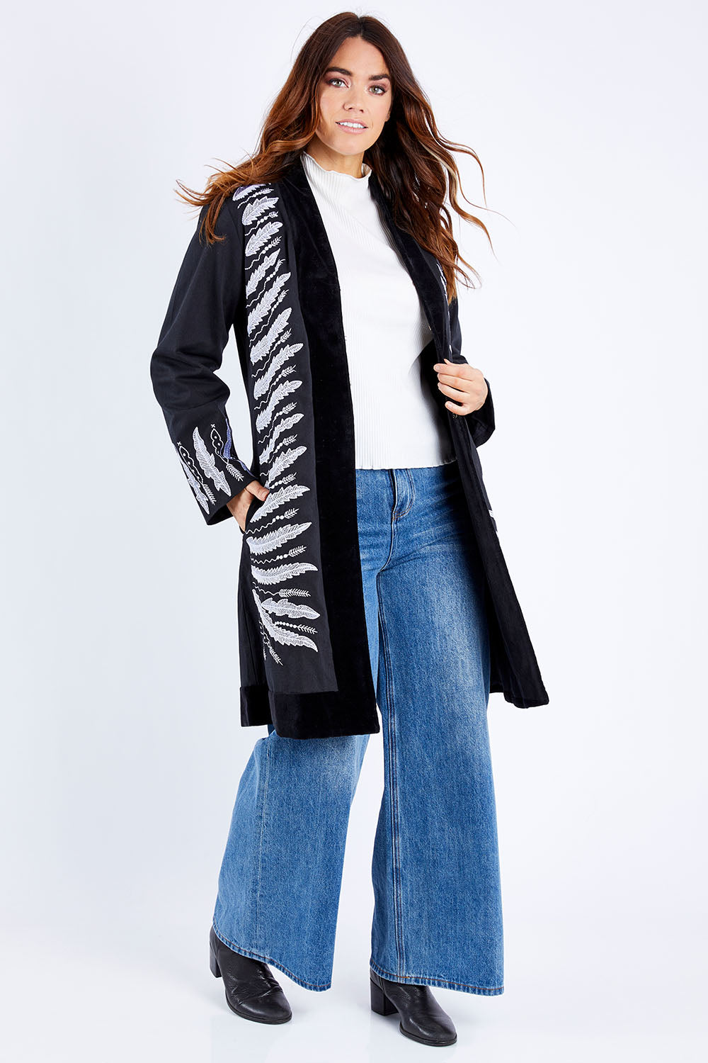 Model Laura wearing size 14 of the Flight Of The Feather Embroidered Jacket in colour Storm (Black), from the front, showing the whole outfit
