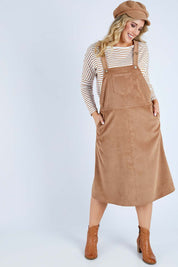 Model Jess wearing size 14 of the My Cord Pinafore Dress in colour Camel, from the front, showing the whole outfit
