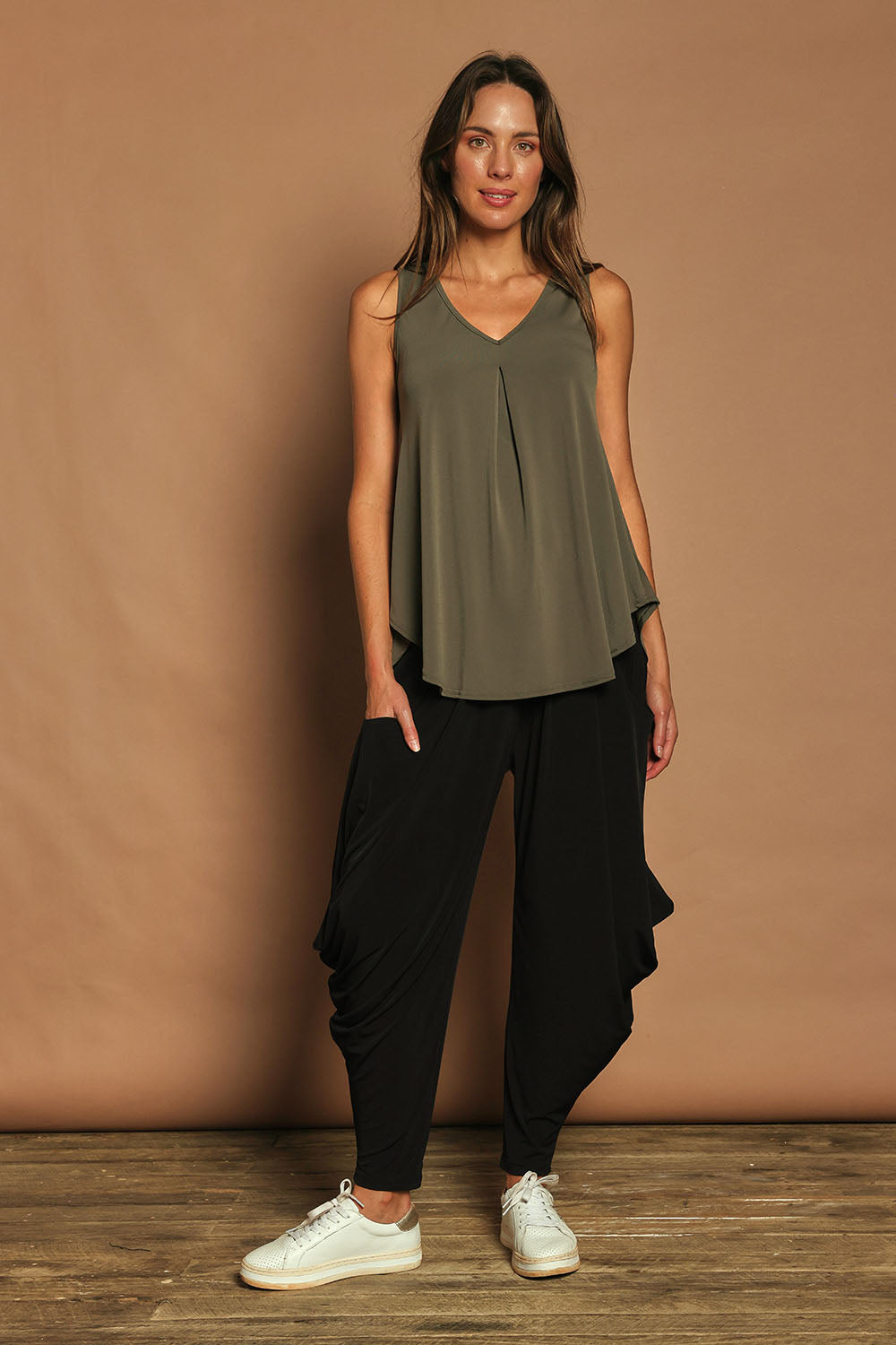 Model Madeline wearing size 10 of The Wanderer In Me Travel Pant in colour Black (Black), from the front, showing the whole outfit