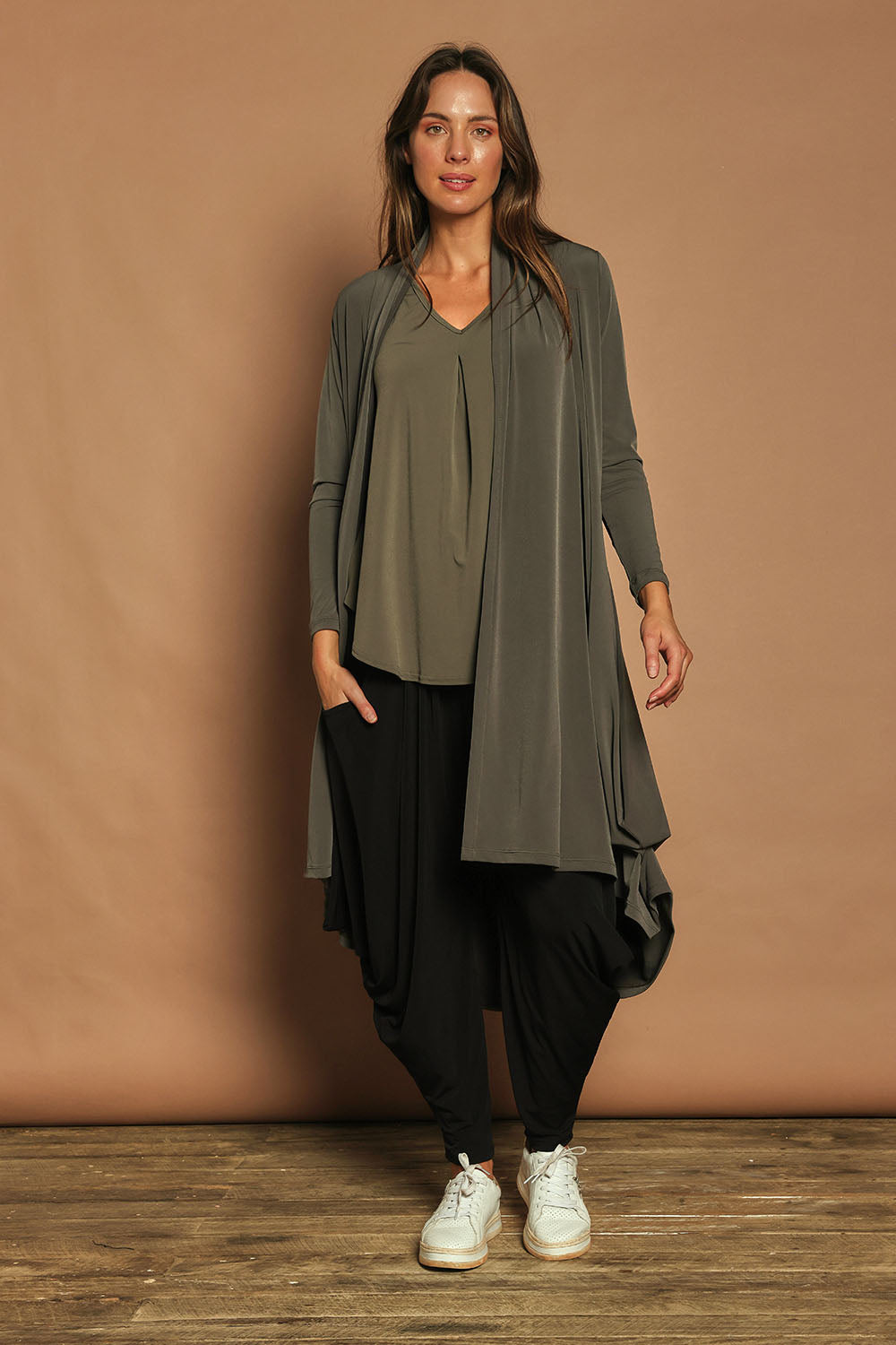 Model Madeline wearing size 10 of The Wanderer In Me Travel Pant in colour Black (Black), from the front, showing the whole outfit