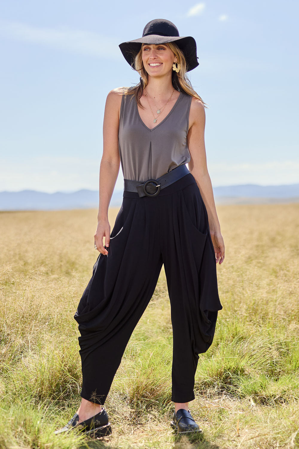 Model Tegan wearing size 10 of The Wanderer In Me Travel Pant in colour Black (Black), from the front, showing the whole outfit