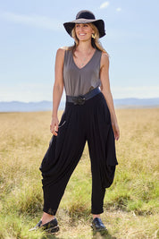 Model Tegan wearing size 10 of The Wanderer In Me Travel Pant in colour Black (Black), from the front, showing the whole outfit