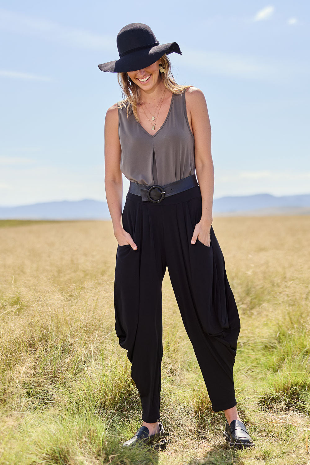 Model Tegan wearing size 10 of The Wanderer In Me Travel Pant in colour Black (Black), from the front, showing the whole outfit