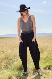Model Tegan wearing size 10 of The Wanderer In Me Travel Pant in colour Black (Black), from the front, showing the whole outfit