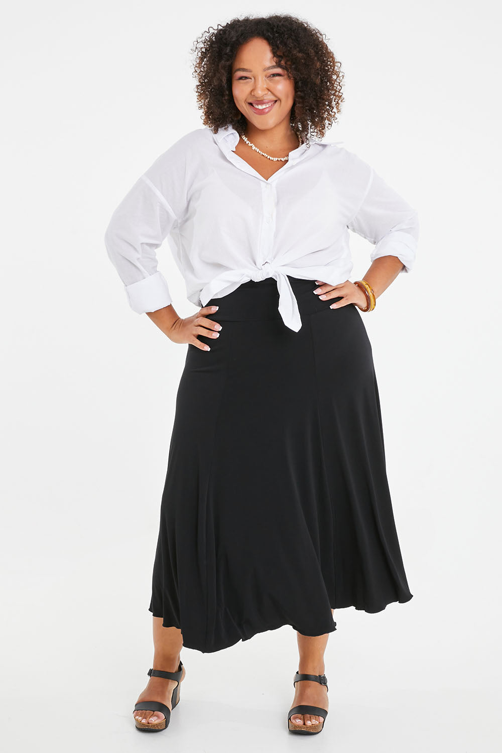 Model Alexis wearing size 16 of The Wanderer In Me Travel Skirt in colour Black (Black), from the front, showing the whole outfit