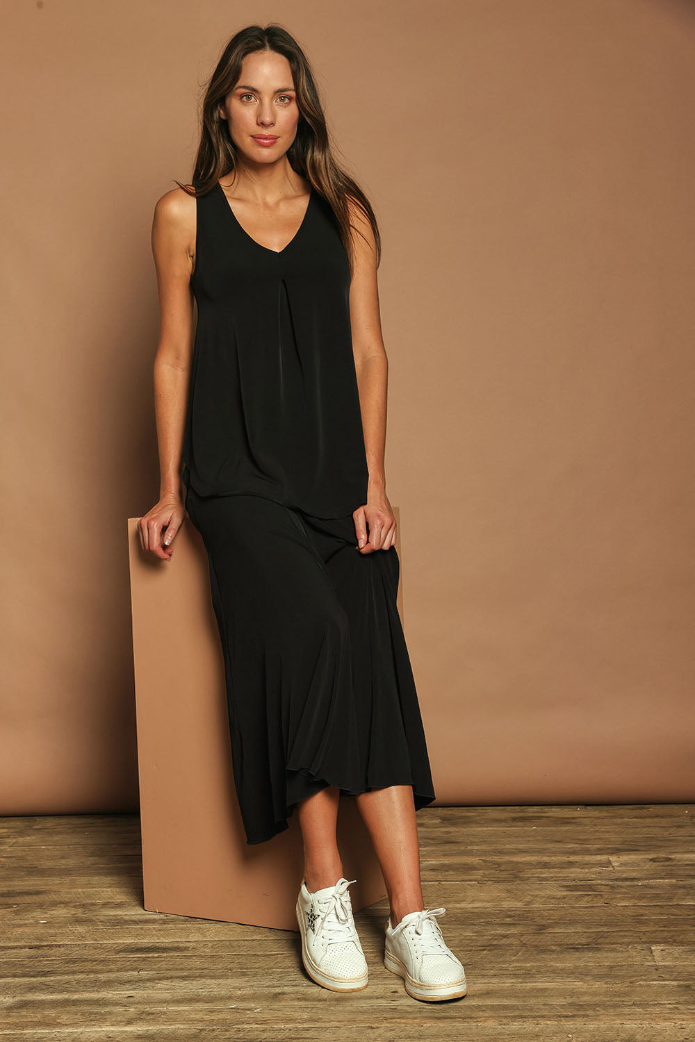 Model Madeline wearing size 10 of The Wanderer In Me Travel Skirt in colour Black (Black), from the front, showing the whole outfit