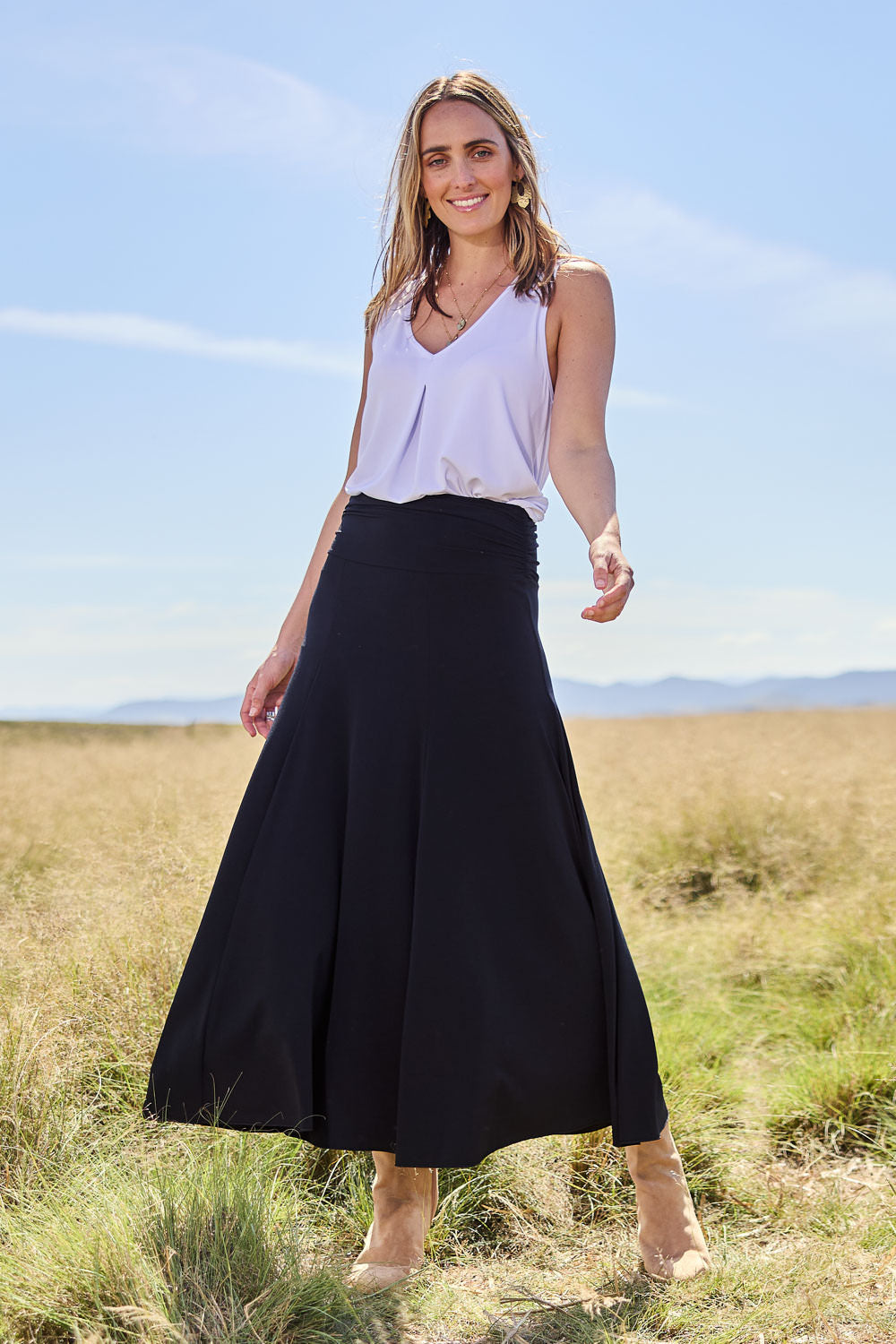 Model Tegan wearing size 10 of The Wanderer In Me Travel Skirt in colour Black (Black), from the front, showing the whole outfit