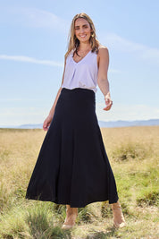 Model Tegan wearing size 10 of The Wanderer In Me Travel Skirt in colour Black (Black), from the front, showing the whole outfit
