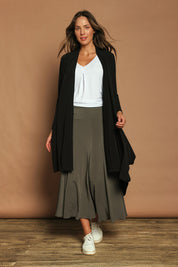 Model Madeline wearing size 10 of The Wanderer In Me Travel Skirt in colour Khaki (Green), from the front, showing the whole outfit