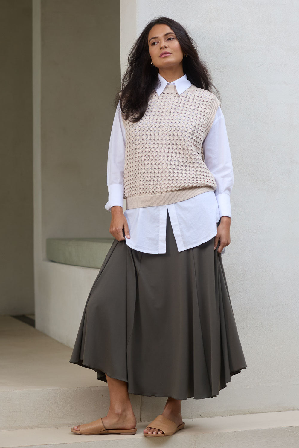 Model Tahnee wearing size 10 of The Wanderer In Me Travel Skirt in colour Khaki (Green), from the front, showing the whole outfit
