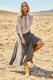 Model Tegan wearing size 10 of The Wanderer In Me Travel Skirt in colour Khaki (Green), from the front, showing the whole outfit