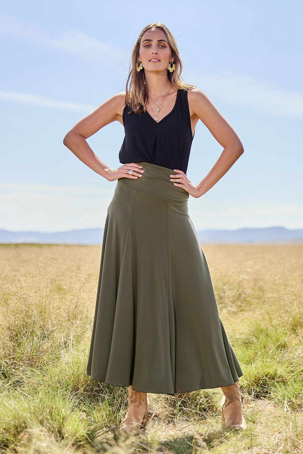 Model Tegan wearing size 10 of The Wanderer In Me Travel Skirt in colour Khaki (Green), from the front, showing the whole outfit
