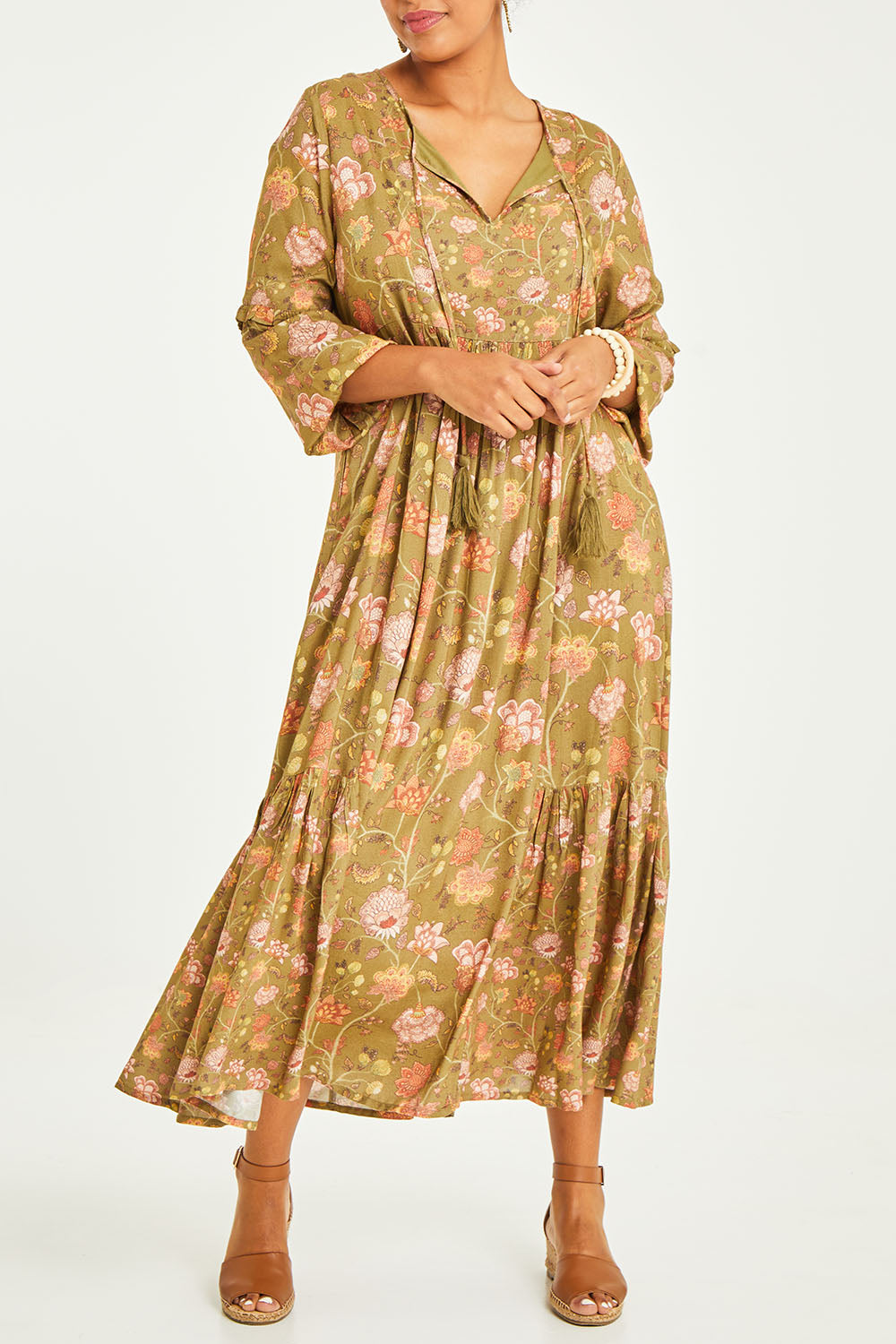 Model Noli wearing size 14 of the Its Better With You Dress in colour Khaki (Green), from the front, cropped image