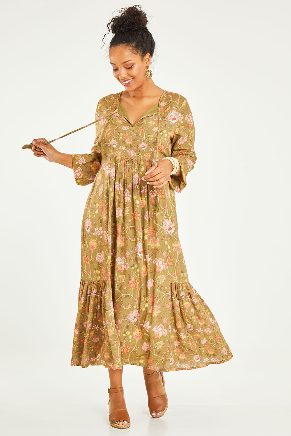 Model Noli wearing the Its Better With You Dress in colour Khaki (Green), from the front, showing the whole outfit